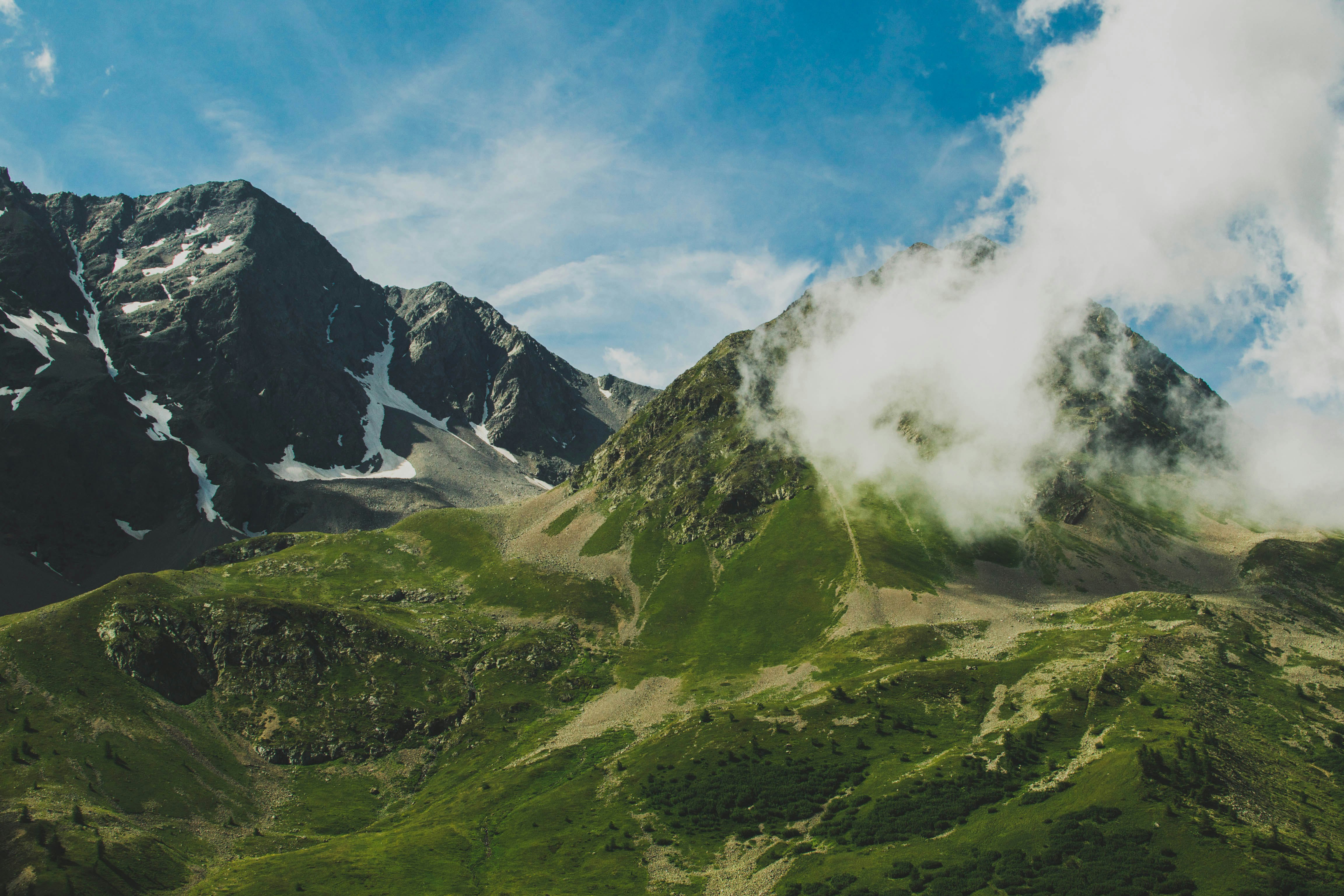 mountain ranges covered with white clouds